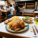 Pollo a la brasa entero con papas fritas y ensalada