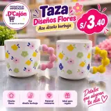 Taza de cerámica con flores y asa de burbujas